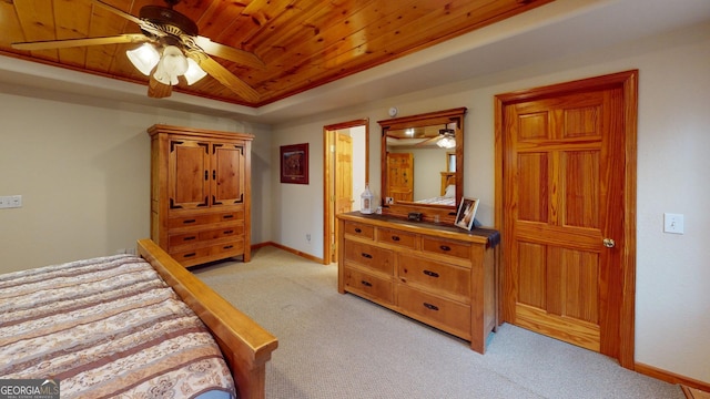 bedroom featuring light colored carpet, a raised ceiling, a ceiling fan, baseboards, and wood ceiling