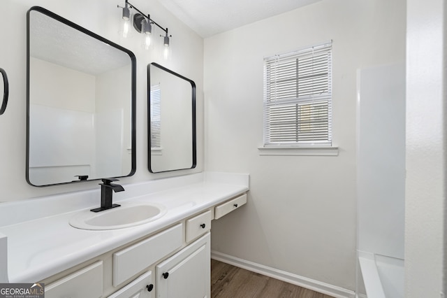 4917 Walden Lake Sq, Decatur, GA 30035 - bathroom featuring vanity, wood finished floors, and tub / shower combination