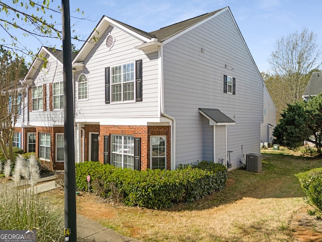4917 Walden Lake Sq, Decatur, GA 30035 - view of property exterior featuring brick siding and a lawn