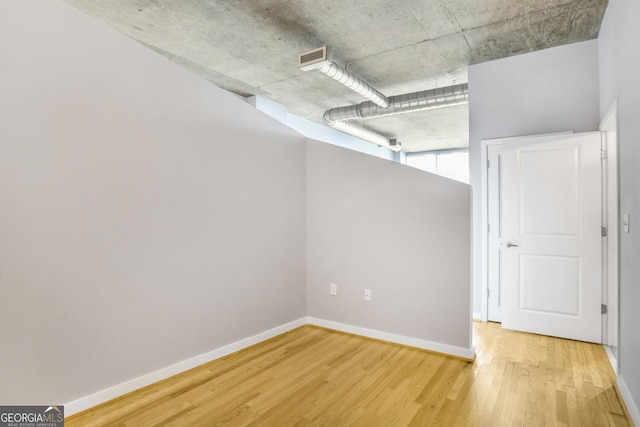 943 Peachtree St NE Unit 1003, Atlanta, GA 30309 - basement featuring light wood finished floors and baseboards