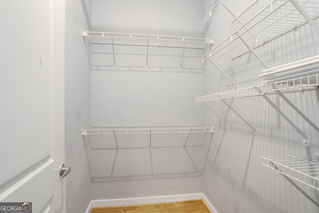 943 Peachtree St NE Unit 1003, Atlanta, GA 30309 - spacious closet featuring wood finished floors