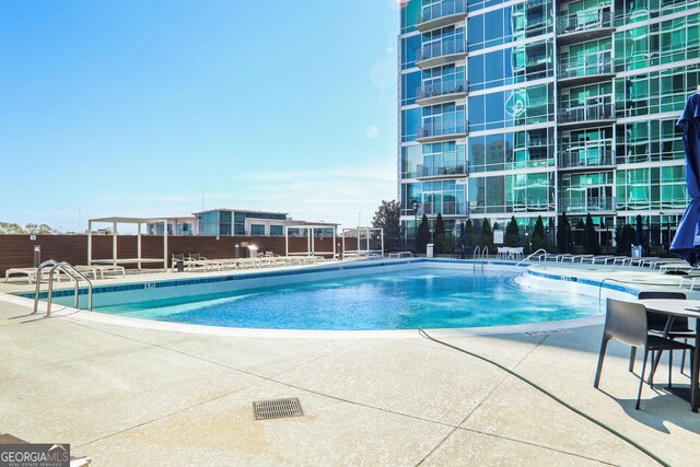 943 Peachtree St NE Unit 1003, Atlanta, GA 30309 - community pool featuring a patio area