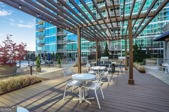943 Peachtree St NE Unit 1003, Atlanta, GA 30309 - wooden terrace with a pergola and area for grilling