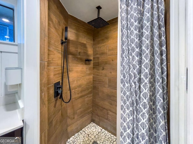 full bathroom with a tile shower