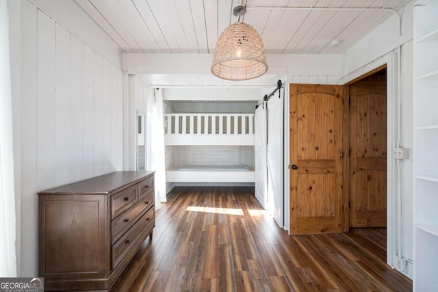 unfurnished bedroom with wood ceiling and dark wood-type flooring