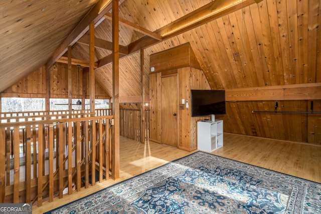 additional living space featuring wood ceiling, vaulted ceiling with beams, wood walls, and wood finished floors