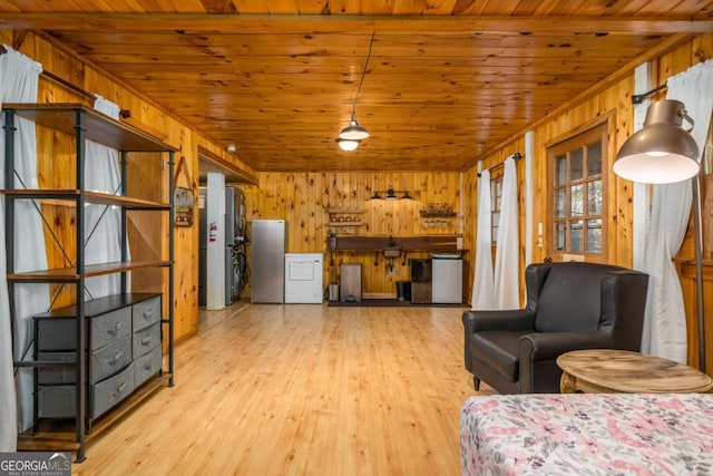 unfurnished living room with wood finished floors, wood walls, and wooden ceiling