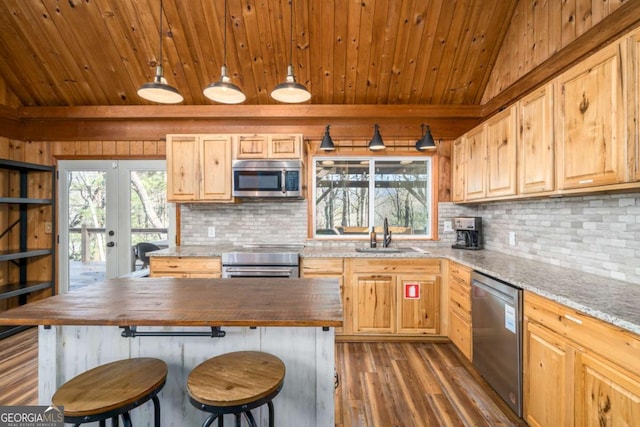 kitchen featuring wood ceiling, french doors, a sink, stainless steel appliances, and wood counters