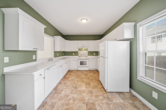 258 Venture Path, Hiram, GA 30141 - kitchen with white appliances, stone finish flooring, a sink, and white cabinets