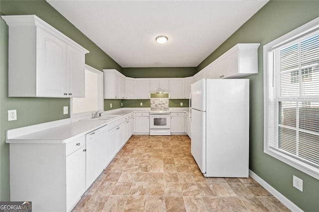 258 Venture Path, Hiram, GA 30141 - kitchen featuring white appliances, stone finish flooring, white cabinets, and light countertops