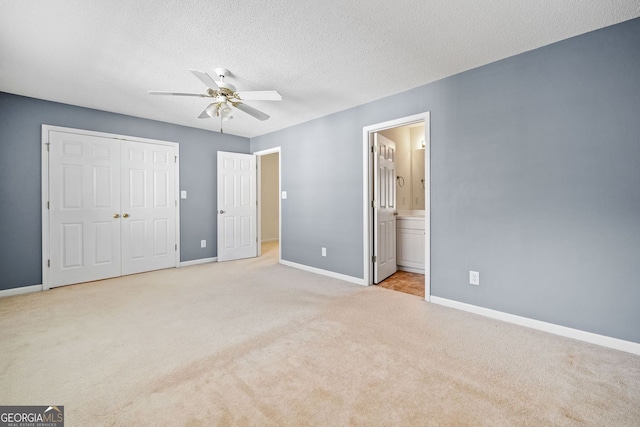 258 Venture Path, Hiram, GA 30141 - unfurnished bedroom featuring carpet floors, baseboards, a closet, ensuite bathroom, and ceiling fan