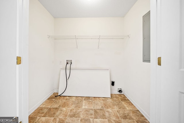 258 Venture Path, Hiram, GA 30141 - laundry room with washer hookup, baseboards, electric panel, and stone finish floors