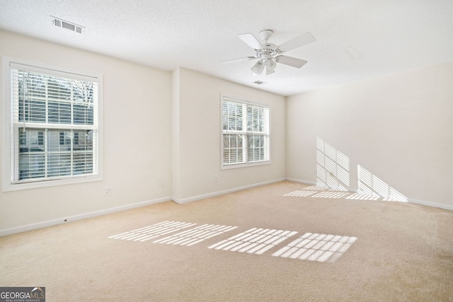 258 Venture Path, Hiram, GA 30141 - empty room featuring carpet, ceiling fan, baseboards, and a textured ceiling