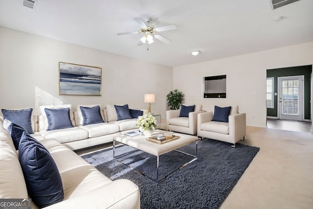 258 Venture Path, Hiram, GA 30141 - living area with a ceiling fan and finished concrete flooring