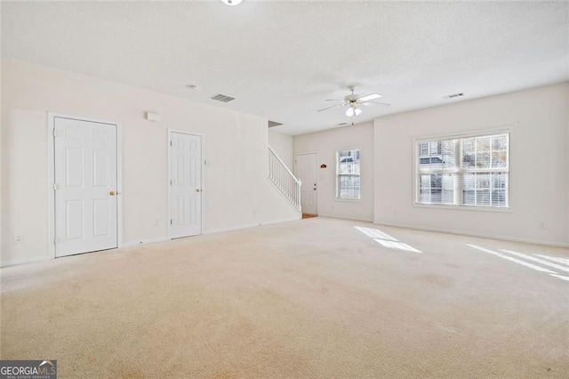 258 Venture Path, Hiram, GA 30141 - unfurnished living room featuring ceiling fan, carpet flooring, and stairs