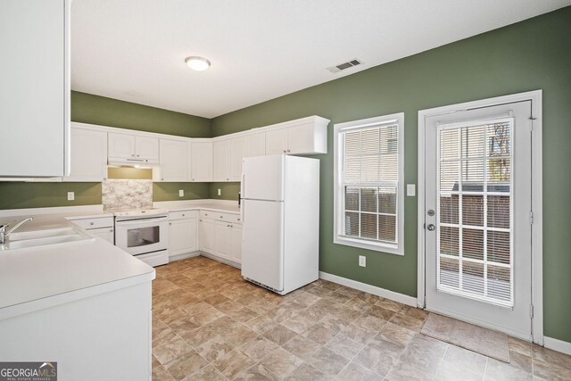 258 Venture Path, Hiram, GA 30141 - kitchen featuring white appliances, a sink, light countertops, white cabinets, and baseboards