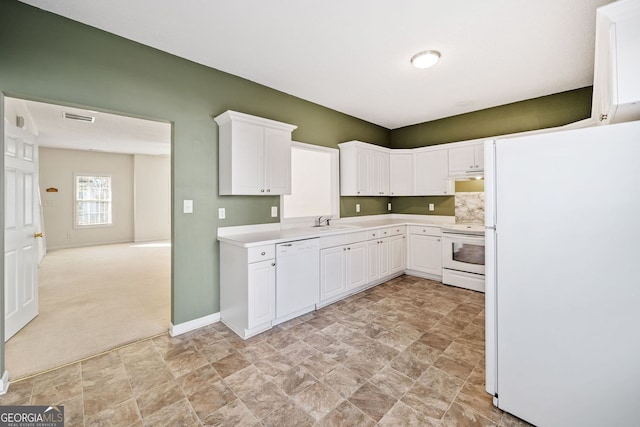 258 Venture Path, Hiram, GA 30141 - kitchen with white appliances, stone finish flooring, a sink, and white cabinets