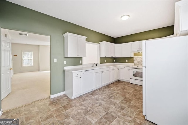 258 Venture Path, Hiram, GA 30141 - kitchen with white appliances, stone finish floors, white cabinetry, light countertops, and under cabinet range hood