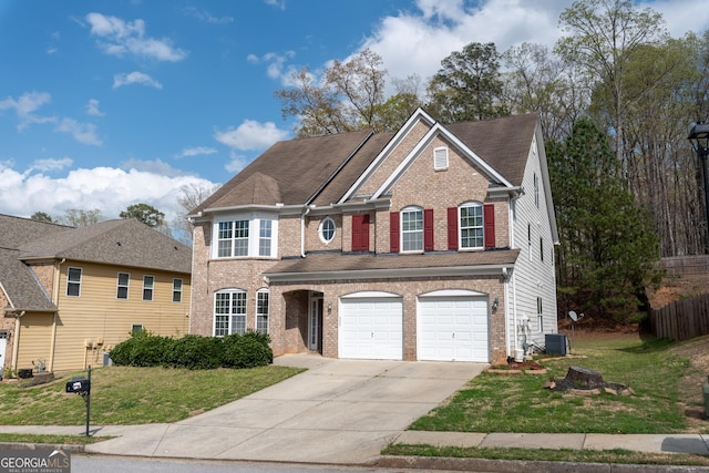 3450 Long Lake Dr, Douglasville, GA 30135 - view of front of home featuring concrete driveway, a front yard, brick siding, and cooling unit