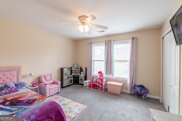 3450 Long Lake Dr, Douglasville, GA 30135 - carpeted bedroom featuring visible vents, a closet, baseboards, and a ceiling fan