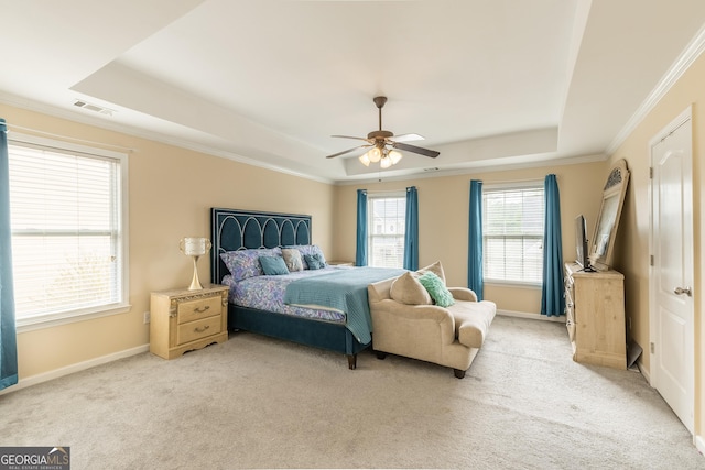 3450 Long Lake Dr, Douglasville, GA 30135 - bedroom with light carpet, crown molding, visible vents, a tray ceiling, and ceiling fan