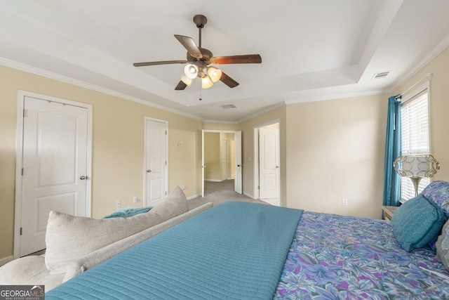 3450 Long Lake Dr, Douglasville, GA 30135 - carpeted bedroom featuring crown molding, visible vents, and a tray ceiling