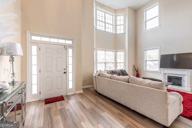 3450 Long Lake Dr, Douglasville, GA 30135 - entryway featuring a wealth of natural light, a high ceiling, and light wood-style floors