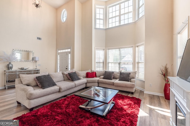 3450 Long Lake Dr, Douglasville, GA 30135 - living room with wood finished floors, baseboards, visible vents, and a wealth of natural light