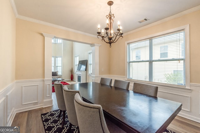 3450 Long Lake Dr, Douglasville, GA 30135 - dining area featuring a notable chandelier, visible vents, dark wood-style flooring, and a healthy amount of sunlight