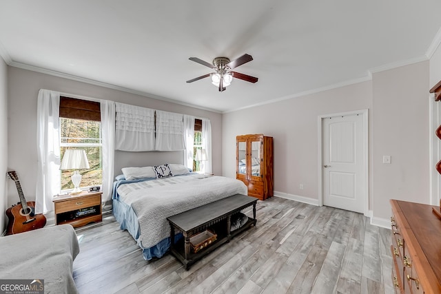 bedroom featuring light wood-style flooring, baseboards, ceiling fan, and crown molding