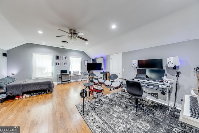 home office featuring recessed lighting, lofted ceiling, wood finished floors, baseboards, and ceiling fan