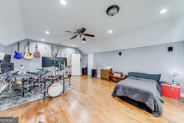 bedroom with vaulted ceiling, wood finished floors, and recessed lighting