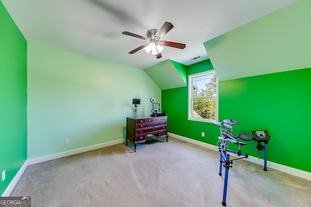sitting room with carpet, vaulted ceiling, visible vents, a ceiling fan, and baseboards