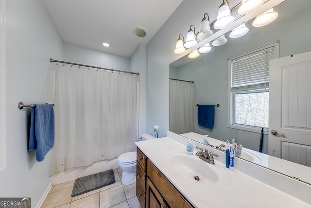 full bath featuring tile patterned floors, toilet, baseboards, a notable chandelier, and vanity