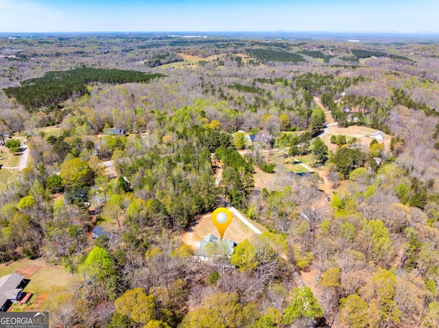 aerial view with a wooded view