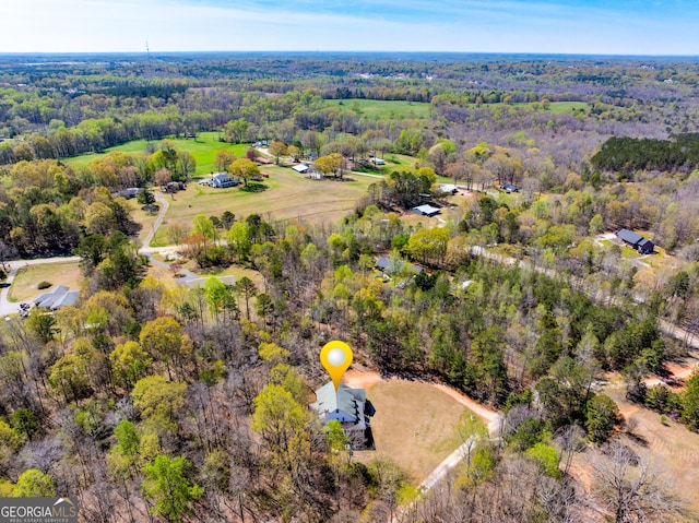 bird's eye view featuring a view of trees