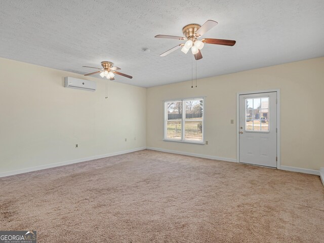 105 Overlook Dr, Mcdonough, GA 30252 - unfurnished room featuring a wall mounted AC, a ceiling fan, plenty of natural light, light carpet, and a textured ceiling
