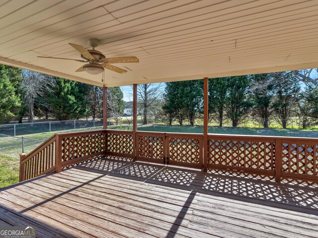 105 Overlook Dr, Mcdonough, GA 30252 - wooden deck with a ceiling fan and view of scattered trees
