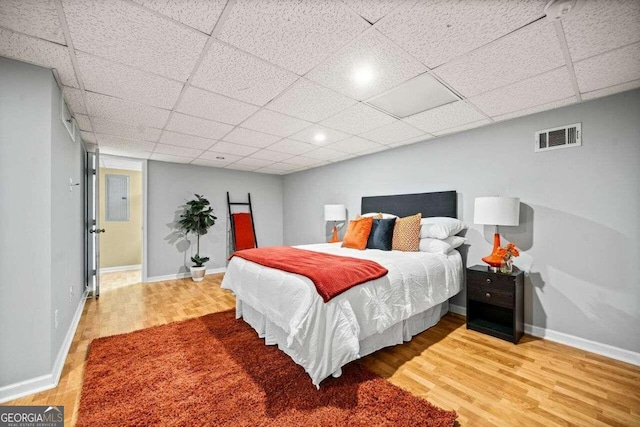 215 Collum St NW, Atlanta, GA 30314 - bedroom featuring baseboards, visible vents, and wood finished floors