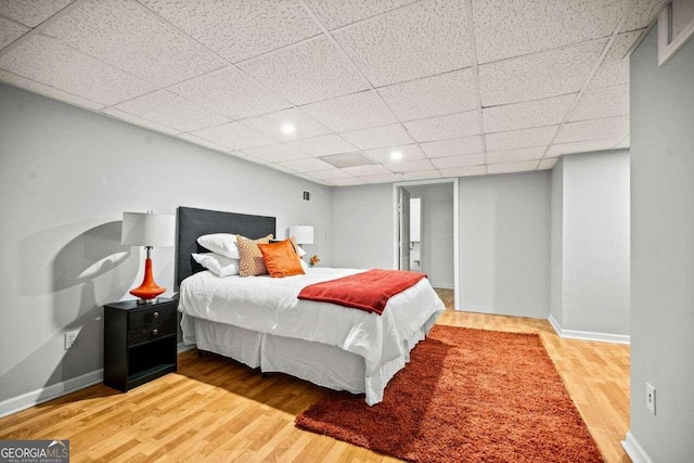 215 Collum St NW, Atlanta, GA 30314 - bedroom featuring baseboards, wood finished floors, and a drop ceiling