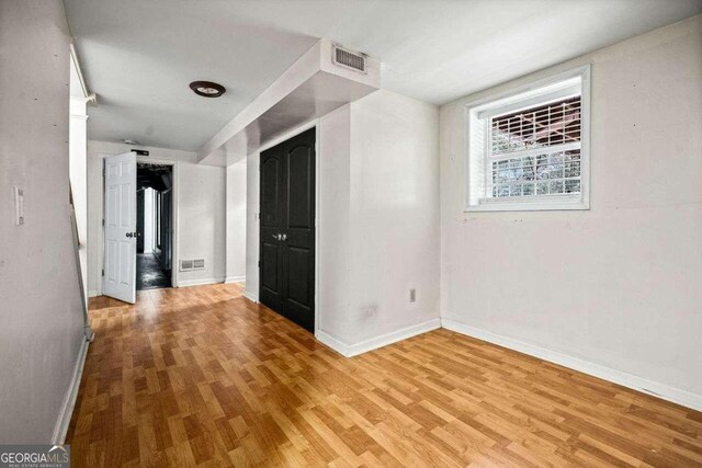 215 Collum St NW, Atlanta, GA 30314 - spare room featuring light wood finished floors, baseboards, and visible vents