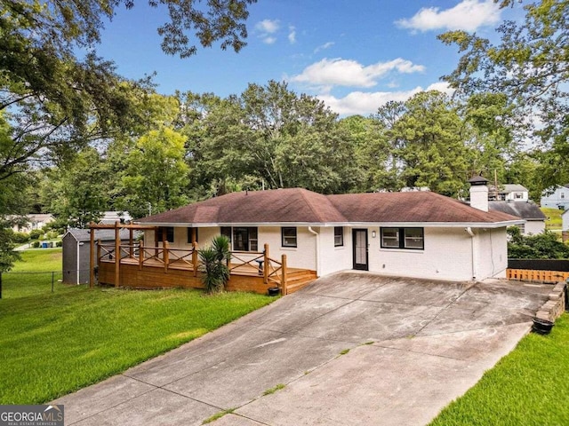215 Collum St NW, Atlanta, GA 30314 - back of house featuring driveway, a chimney, fence, brick siding, and a lawn