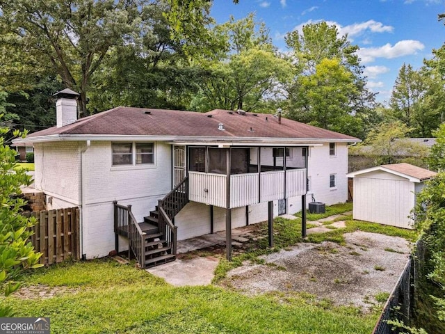 215 Collum St NW, Atlanta, GA 30314 - back of house featuring an outbuilding, a sunroom, stairs, fence, and a chimney