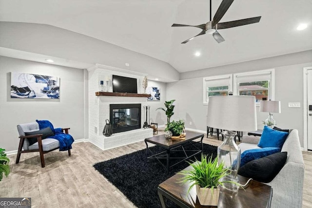 215 Collum St NW, Atlanta, GA 30314 - living room with a brick fireplace, lofted ceiling, baseboards, a ceiling fan, and wood finished floors