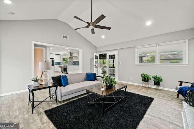 215 Collum St NW, Atlanta, GA 30314 - living area with vaulted ceiling, a ceiling fan, light wood finished floors, baseboards, and visible vents