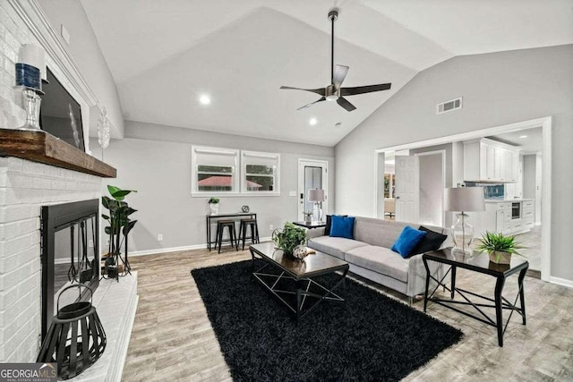 215 Collum St NW, Atlanta, GA 30314 - living room featuring visible vents, baseboards, ceiling fan, lofted ceiling, and light wood-type flooring