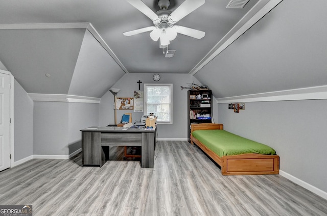 interior space featuring baseboards, a ceiling fan, and wood finished floors