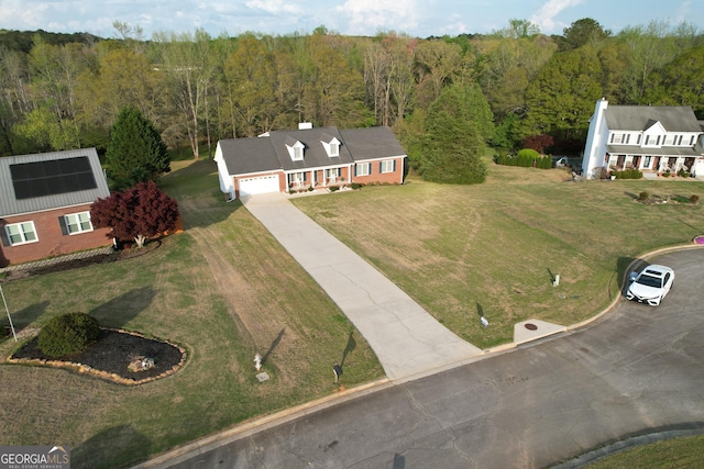 aerial view featuring a wooded view