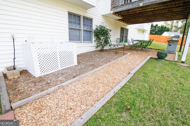 view of yard featuring fence and a patio