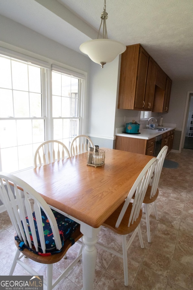 dining room with a textured ceiling